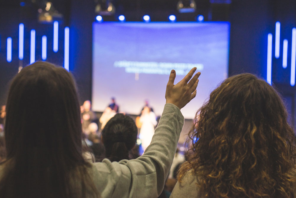 Church goers worshiping and singing at a church service