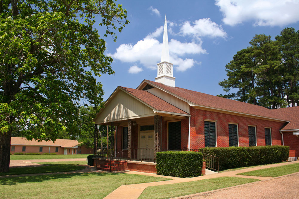Small Rural Church With Blue Sky and Trees